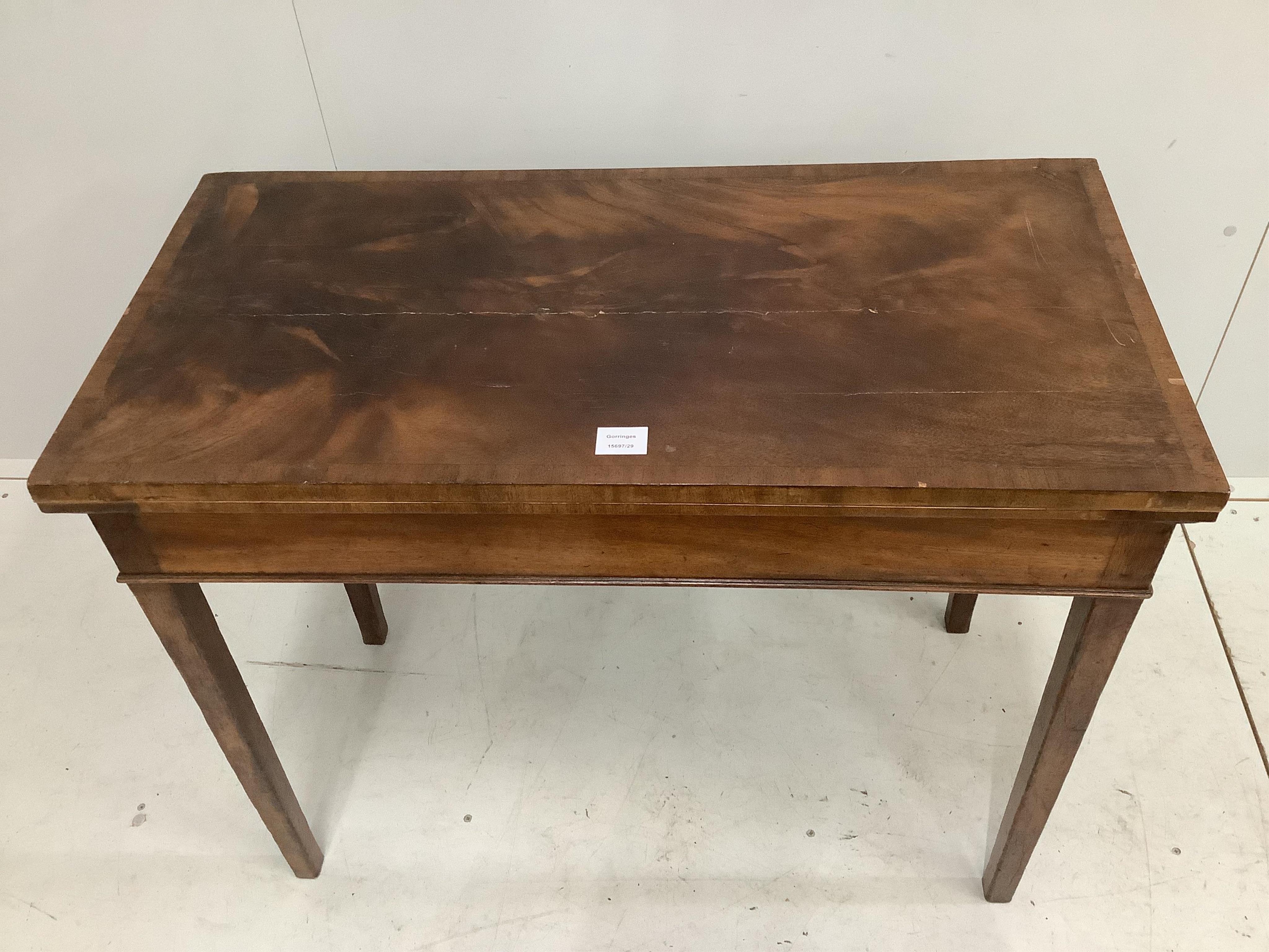 A George III rectangular mahogany folding card table, width 91cm, depth 45cm, height 73cm. Condition - poor